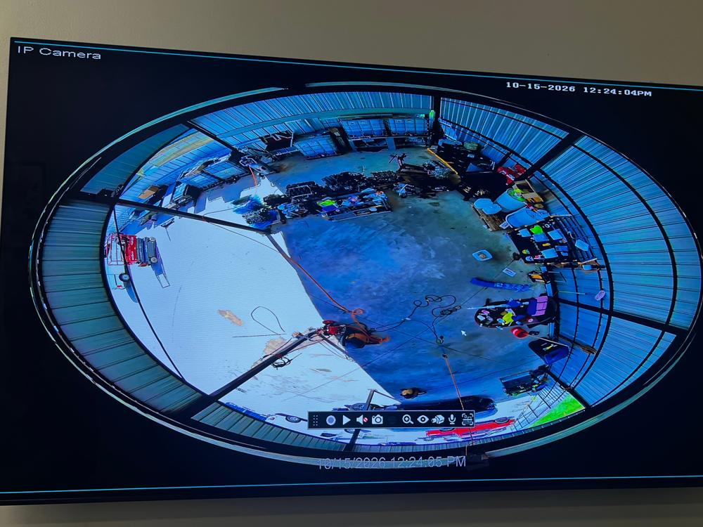 360 degree fisheye camera view of an industrial workshop on a monitor